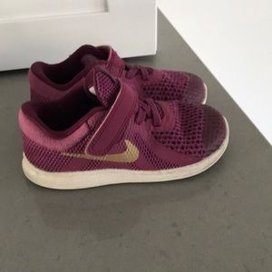 Nike purple and gold shoes